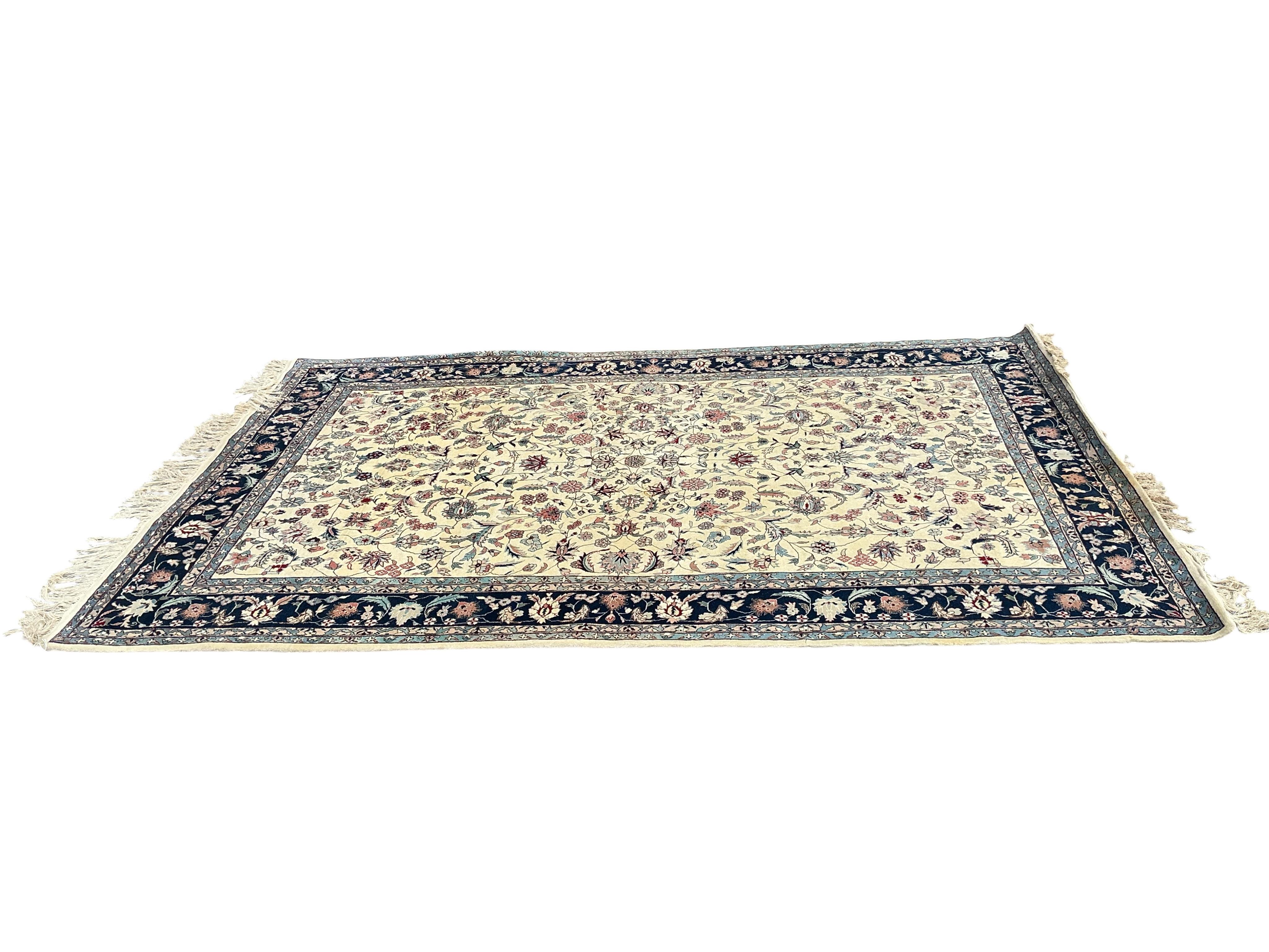 A Tabriz ivory ground floral rug, 240 x 150cm